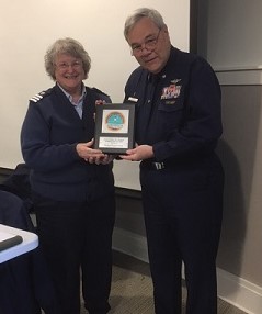 Division Commander Duane Minton presenting Flotilla Commander Darrell Gilman, Flotilla 013-01-05 Penobscot Bay, with Auxiliary Operations Service Award for 42 hours as Lead Instructor.