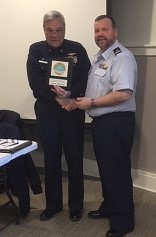 Division Commander Duane Minton presenting Flotilla Commander Darrell Gilman, Flotilla 013-01-05 Penobscot Bay, with Auxiliary Operations Service Award for 42 hours as Lead Instructor.