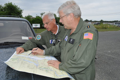 Aux Air crew reviewing their patrol route