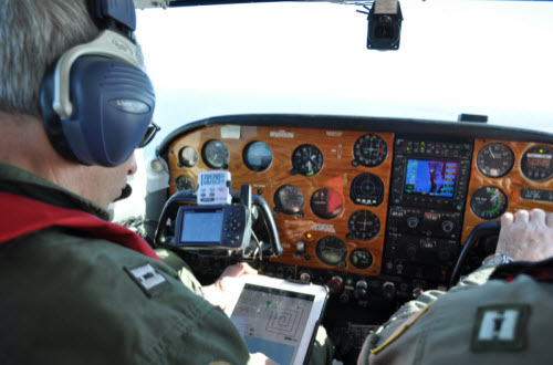 Aux Air pilot plotting a search pattern in flight