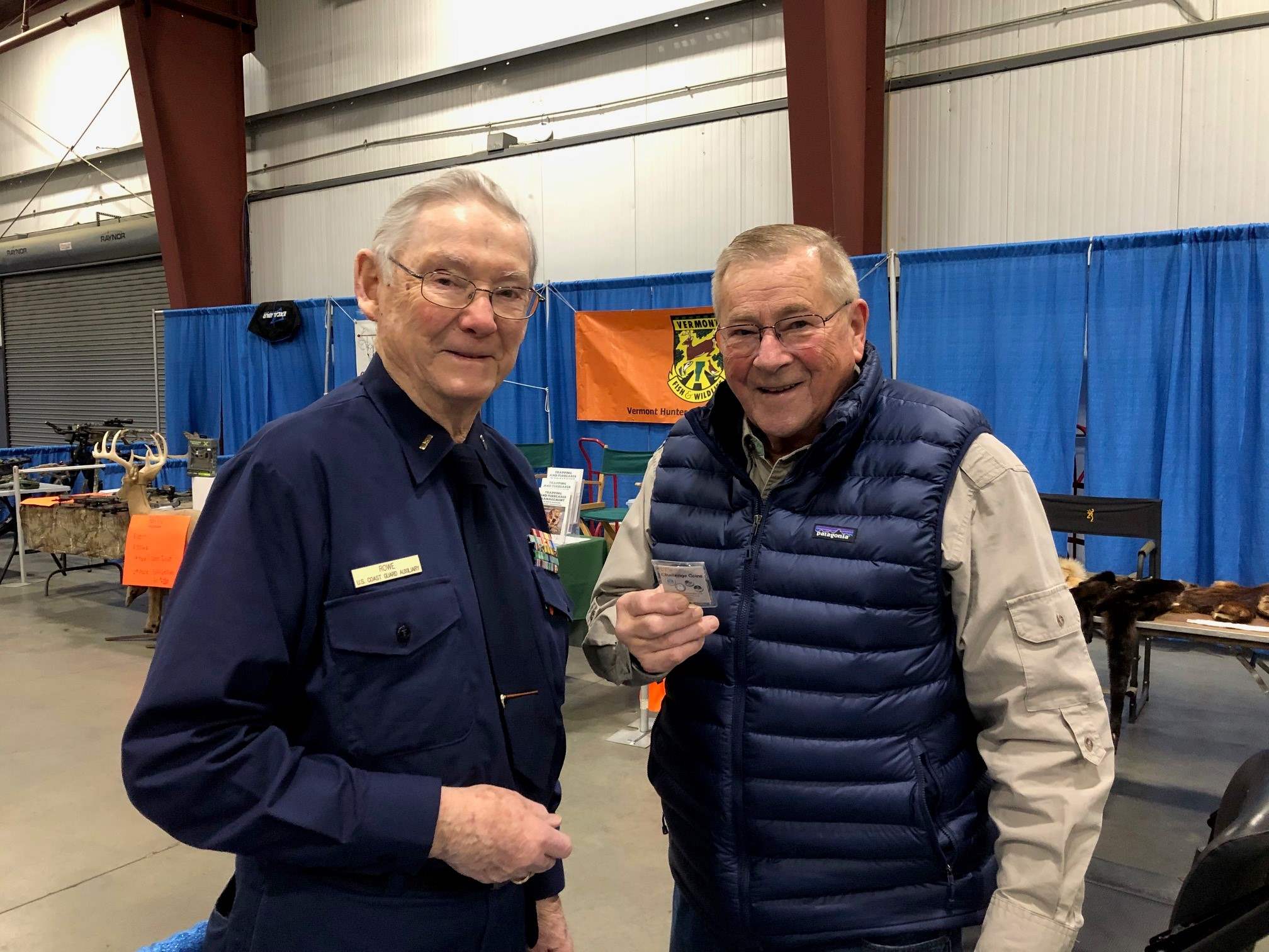 AUX member presenting flotilla coin to Sportsman Classic manager