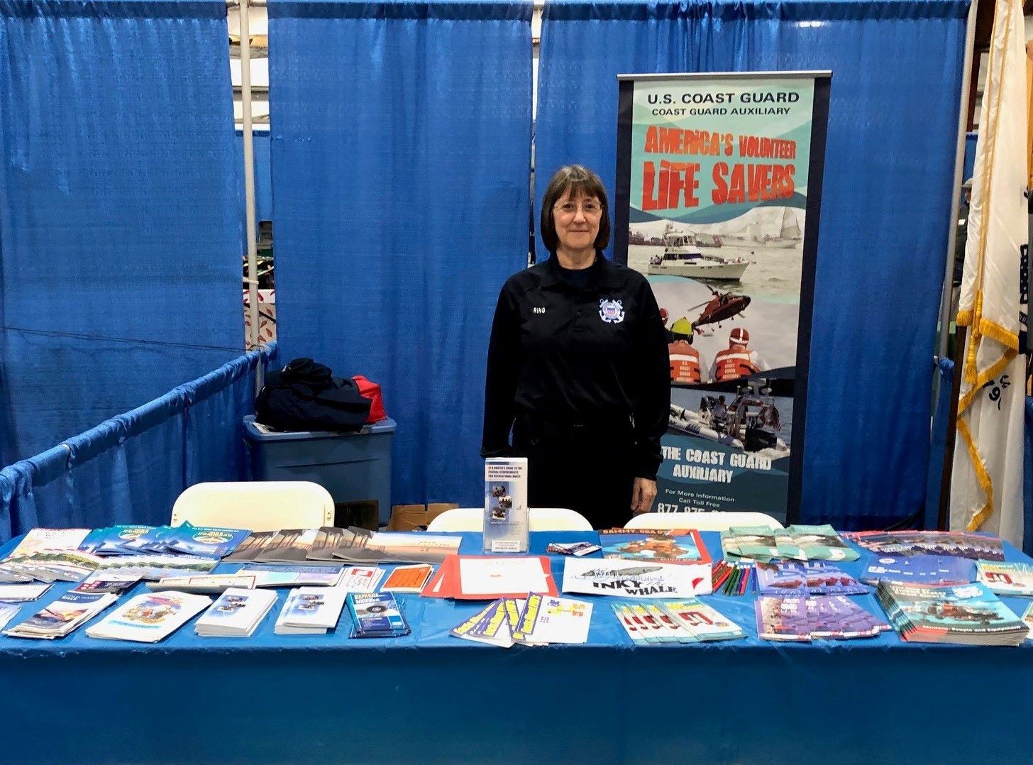 Aux member behind boating safety table