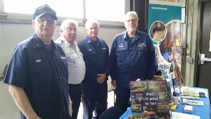 From left to right, standing behind the Flotilla display table, are Carl Crump, Richard Price, John Craig, and Steve Straneva 