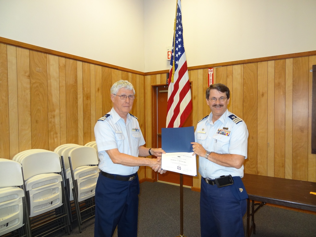 Bob Mcleary receives member service award from Mark Latish