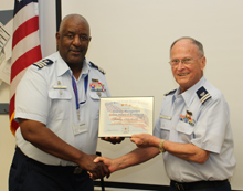 On behalf of District 5 Northern Region, Ernie Stevens (Diversity Staff Officer) presents the Diversity Management 3 Star Award of Excellence to Flotilla 053-12-09 Commander Dick Stevenson during the APR 2017 Flotilla meeting.