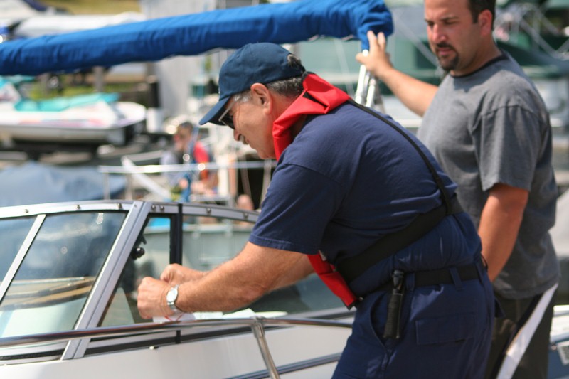 picture of an examiner placing a sticker on a vessel