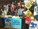Boating safety booth manned by auxiliary member