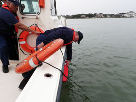 Retrieving dummy overboard