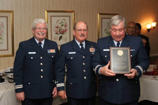  Flotilla Commander Paul Morin and Immediate Past Flotilla Commander John Galleazzi  award Bruce Rowley as 2012 Auxiliarist of the Year