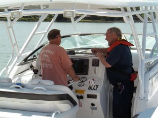 Auxiliarist lking with Boat Owner