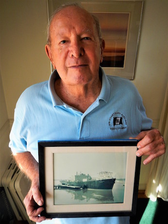 Rich Miller with photo of US Army floating nuclear power plant MH 1A Sturgis