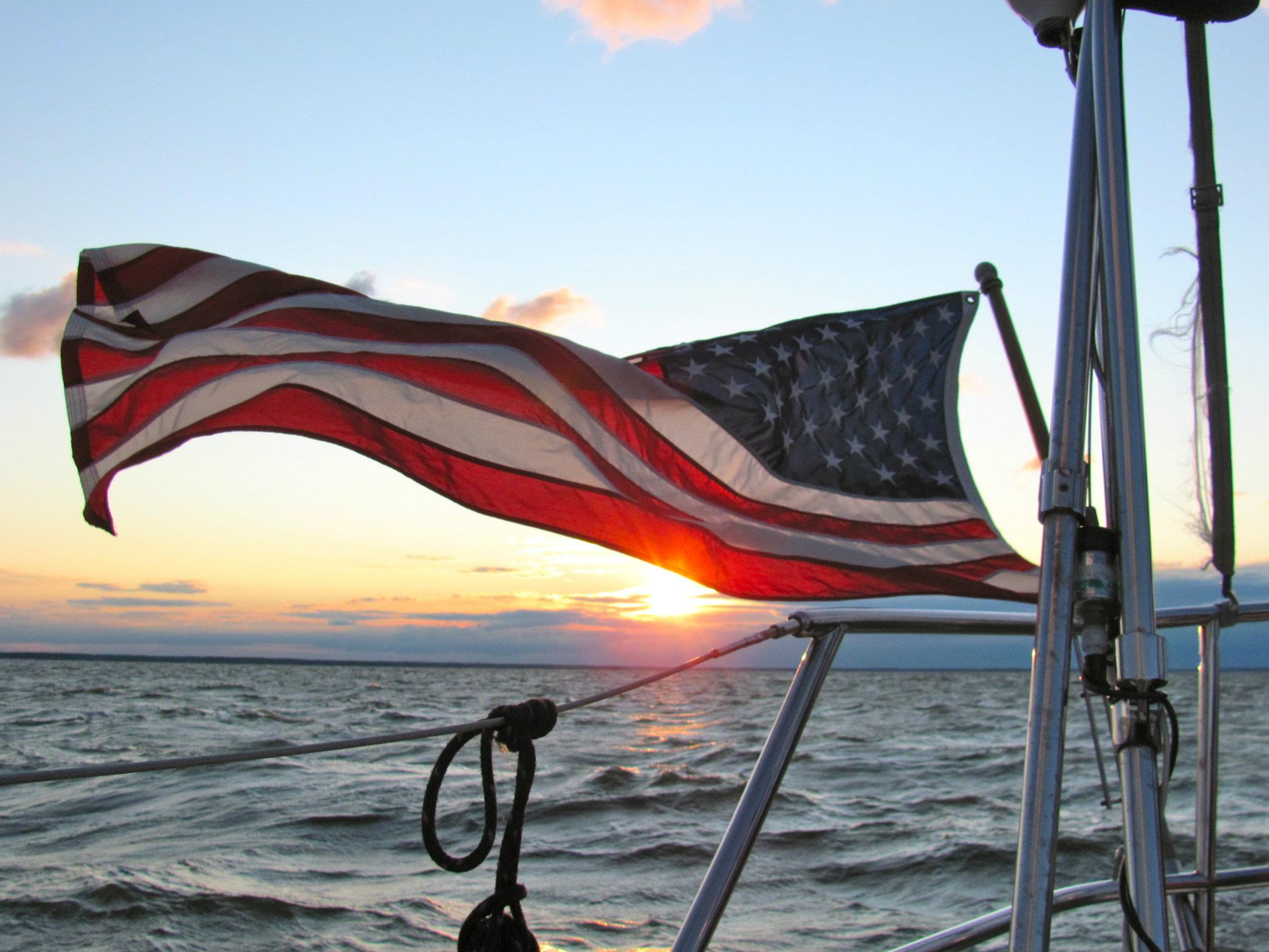 American flying in the breeze from boat
