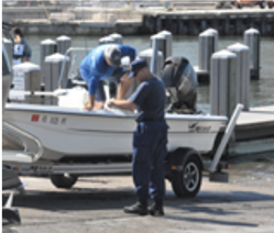 Flotilla 84 members performing vessel exams at the 10th street ramp