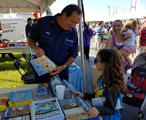 Coast Guard Auxiliary Member interacting with the public