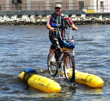 Man rowing a bicycle vessel