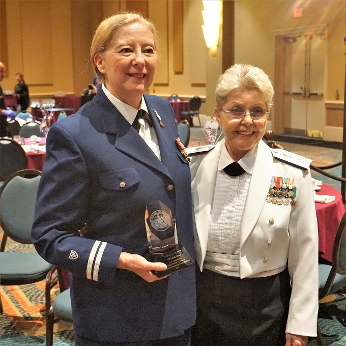 Linda Jone poses for a photo with Commodore Judith Hudson