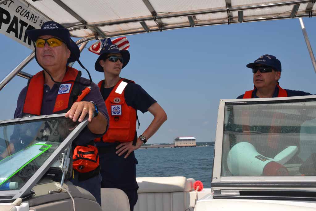 Three CGA members in a patrol boat