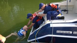 John Franko assists Tim Ruane during Man Over Board training with "Oscar"