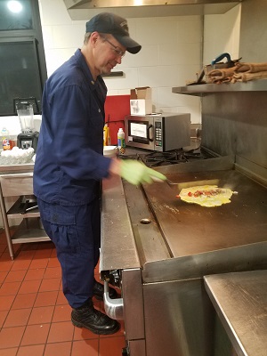John Rose Fixing an Omelet