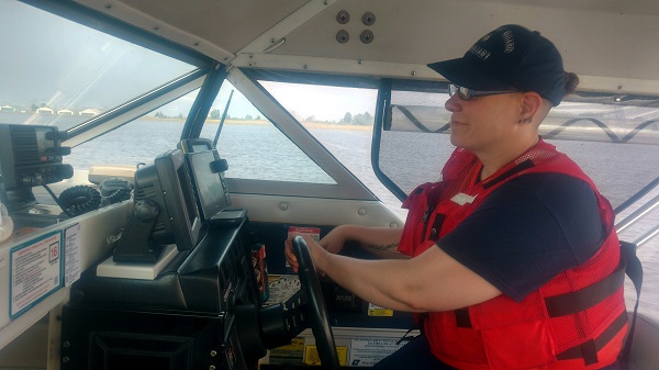 boat crew at the helm