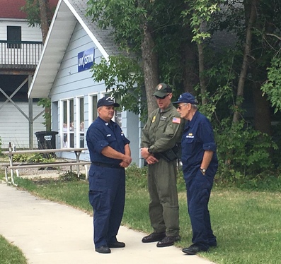 Auxiliarists talking with Voyageurs National Park partner - park pilot & law enforcement ranger