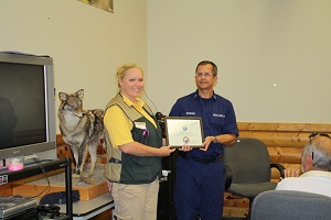 Certificate of Appreciation being presented to Gander Mountain