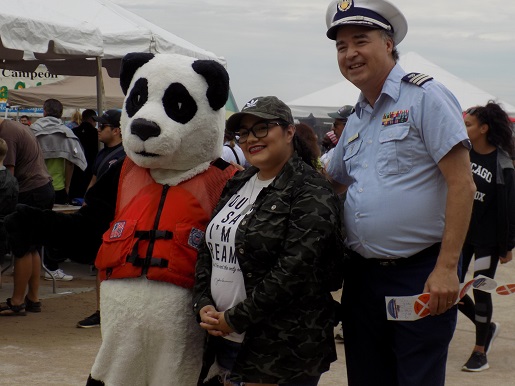 panda with officer and a lady