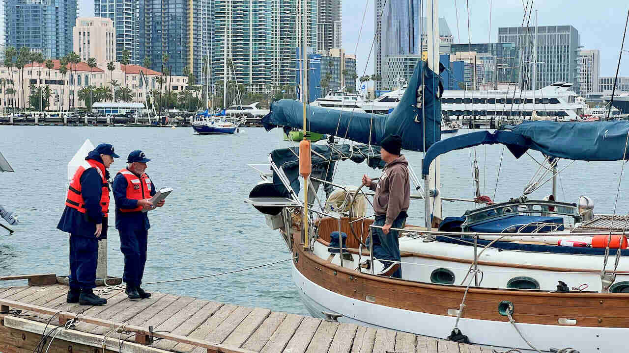 Auxiliarists on dock for vessel exam