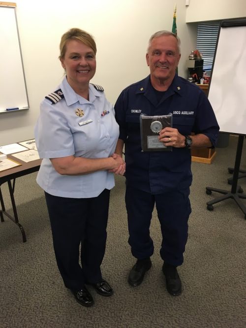 Picture of Flotilla Commander Robert Cromley receiving the 'Auxiliarist of the Year' award.
