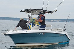 USCG Petty officer checking PFD on safety patro;