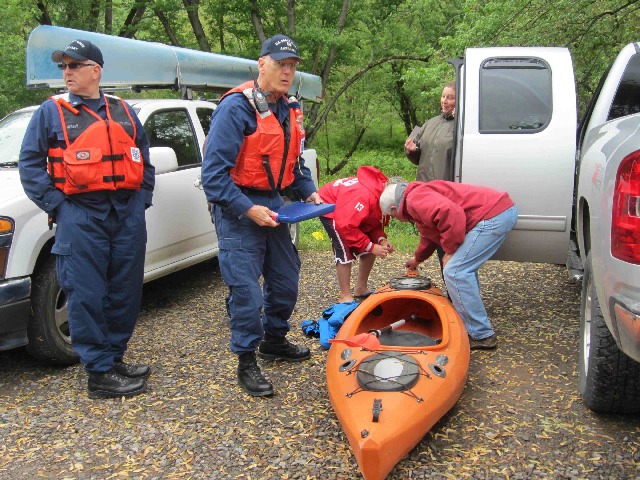 Jim Wilson conducting a Vessel Safety Check for canoe race participants