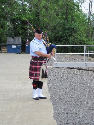 Charles Poltenson playing Semper Paratus on the bagpipes
