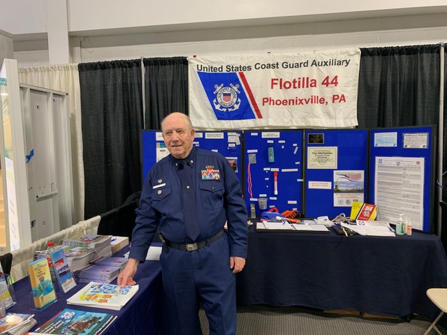 Auxiliary member at booth at boat show