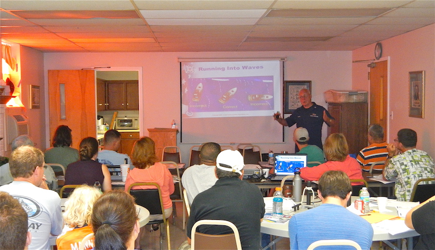 An instructor with U S Coast Guard Auxiliary Flotilla 25 O 8 teaching boat handling during an About Boating Safety class