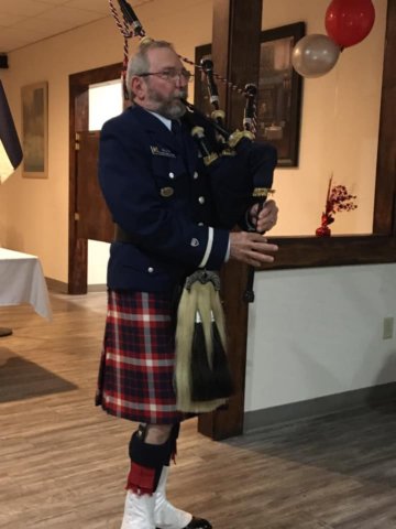 Bob Miller playing the bag pipes