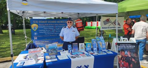 Auxiliarist at a display table