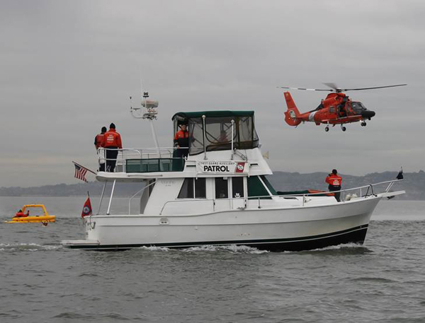 Auxiliary Patrol Vessel Melody and Coast Guard Helicopter Participating in Training Exercise