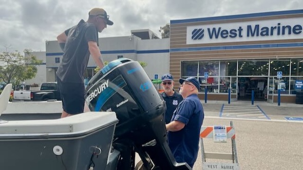 Two members inspecting a vessel at West marine