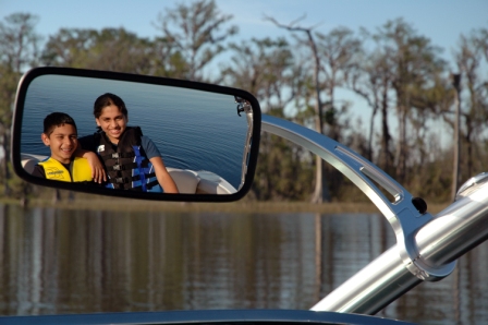 Boy and Girl in rear view mirror